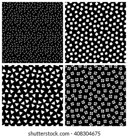 Black and white chaotic ethnic geometric seamless patterns set, vector backgrounds