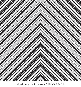 Black and white Chevron diagonal striped seamless pattern background suitable for fashion textiles, graphics