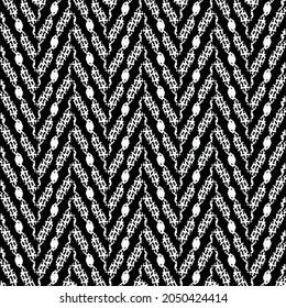 A black and white chevron pattern. Artistic zigzag background. Carpet motif image. 