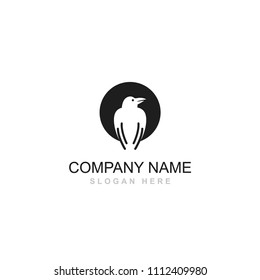 Black white crow bird sitting vector logo