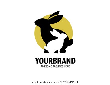 black and white cute bunny sitting with circle color background vector illustration