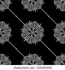Black and white diagonal seamless pattern of dotted flowers, snowflakes, stars in garlands. Mosaic floral print of white dots. Geometric print of beads. Vector Illustration.