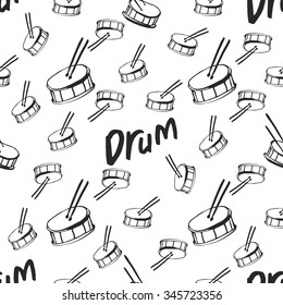 Black and white doodle drums seamless pattern.With an inscription Drum
