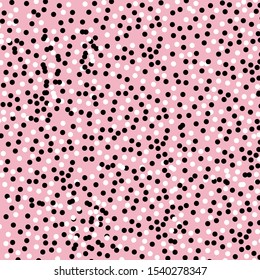 black and white dot on pink background.