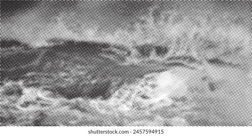 Black and white dotted halftone background.