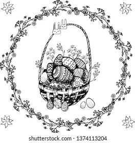 Black and white Easter Basket with 
Easter eggs in a wreath of herbs