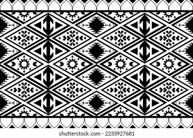 Black and white geometric ethnic seamless pattern design for wallpaper, background, fabric, curtain, carpet, clothing, and wrapping.