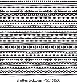 Black and white geometric seamless vector pattern. Striped boho texture. Ethnic or tribal monochrome background with tiny triangles, uneven stripes and dots.