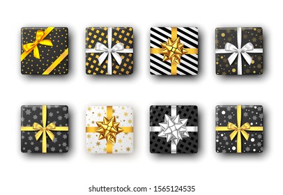 Black and white gift box with silver and golden ribbon and bow, top view. Christmas, New Year party, Happy birthday package design.  