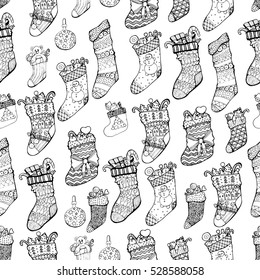 black and white graphic Christmas background from hand drawn linear cosy knitted socks with patterns filled with gifts. Vector EPS10