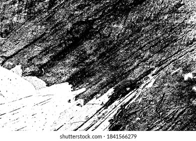 Black and white grunge texture. Black streaks of paint, ink, and dirt. Abstract monochrome background. Pattern of scratches, chips, and wear