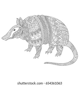 Black and white, hand drawn doodle illustration of armadillo with zentangle style tribal floral pattern for adult coloring book.