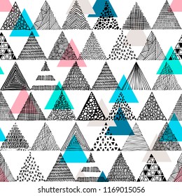 Black and white hand-drawn triangles in a doodle style and colored triangles. Seamless vector pattern.