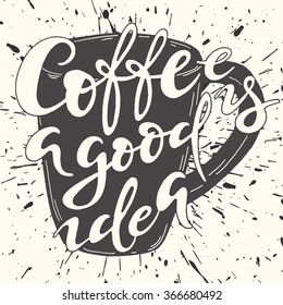 Black and white handwritten lettering on the cup; Coffee is a good idea - text on mug with grunge splash background