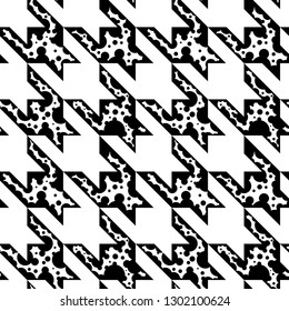 Black and white houndstooth seamless pattern. A modern approach to classical textile design. Vector drawing repeat pattern of hounds tooth check. Endless wallpaper style. 