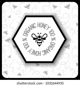 black and white icon with bee logo on background of honeycomb