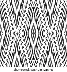 Black and white ikat seamless pattern in uzbek, ottoman style. Ethnic background. Textured vector illustration for textile, wallpaper, card or wrapping paper.