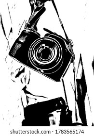 imagen en blanco y negro de una cámara colgando.