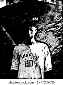 black and white image of a man smiling in the dark.