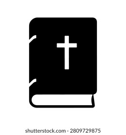 A black and white image of a religious book featuring a prominent cross on the cover, symbolizing faith and spirituality.