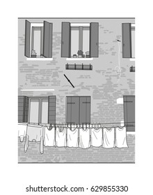 Black and white Italian house with laundry