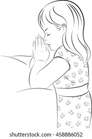 Black and white line drawing of a young girl wearing pajamas, kneeling beside her bed with her hands together saying her bedtime prayers.