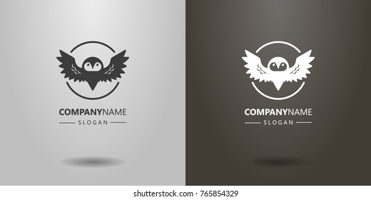 black and white logo of an abstract owl with spread wings