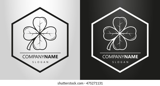 black and white logo with a four-leaf clover in a hexagon