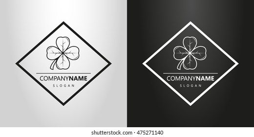 black and white logo with a four-leaf clover in a rhombus
