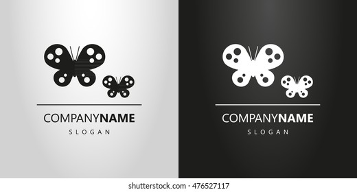 black and white logo with silhouettes of two butterflies