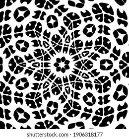 black and white mandala. symmetrical patterns.
