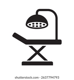 Black and white medical examination table and light
