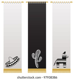 black and white mexican wall hangings with gold tassel fringing, isolated on white