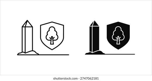 Black and white obelisk and shield with tree emblem