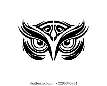 ﻿A black and white owl face tattoo with Polynesian designs.