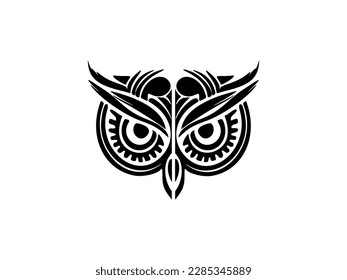 ﻿ A black and white owl face tattoo adorned with Polynesian designs.