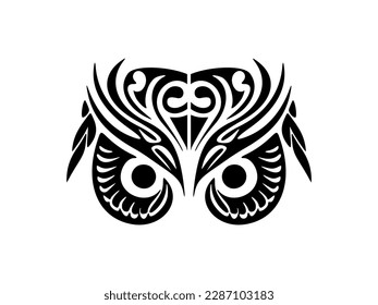 ﻿A black and white owl face tattoo with Polynesian designs.