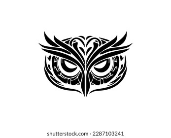 ﻿Tattoo of a black and white owl with Polynesian designs on its face.