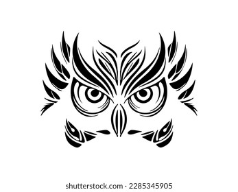 ﻿A black and white owl with Polynesian motifs depicted on its face.