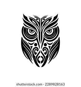 ﻿A black and white owl tattoo decorated with Polynesian designs.