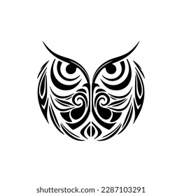 ﻿A black and white owl tattoo featuring Polynesian designs.