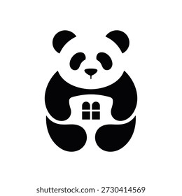 Black and white panda bear holding a house in its arms