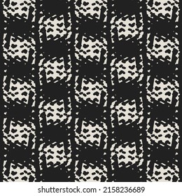 Black and white pattern with stripes and plaids. Detail from a knitted cotton blanket. Decorative graphics.