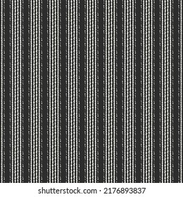 Black and white pattern, with thinner or thicker stripes arranged alternately. The texture of a ribbed blanket. Upholstery fabric. Abstract vector.