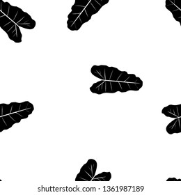 Black and white pattern of tropical leaves. Seamless background with palm leaves.