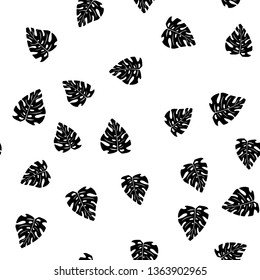 Black and white pattern of tropical leaves. Seamless background with palm leaves.