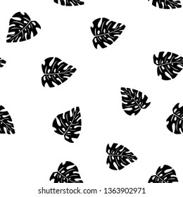 Black and white pattern of tropical leaves. Seamless background with palm leaves.