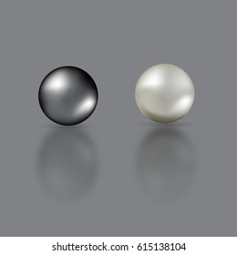 Black and white pearls with mirror reflection isolated on grey background.