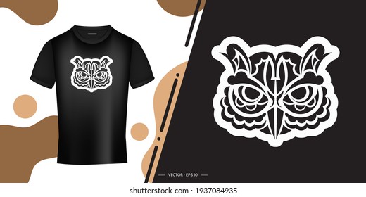 Black and white print of the face of an owl in boho style. Good for clothing and textiles. Vector illustration.