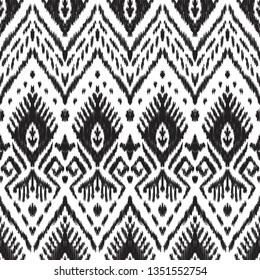 Black and white seamless background. Ethnic ikat ornament. Vector illustration. Tribal pattern. Can be used for textile, wallpaper, wrapping paper, greeting card backdrop, print.